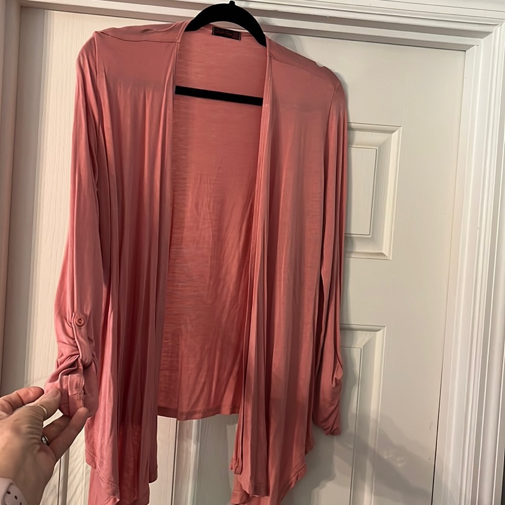 Dusty rose fashion jacket . 95% rayon 5% spandex . Super soft .